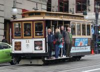A San Francisco cable car on a city street